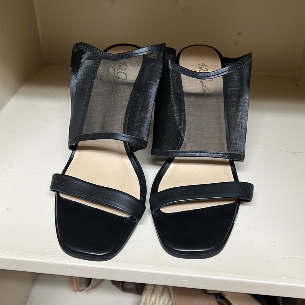 Black mules with mesh strap detail
